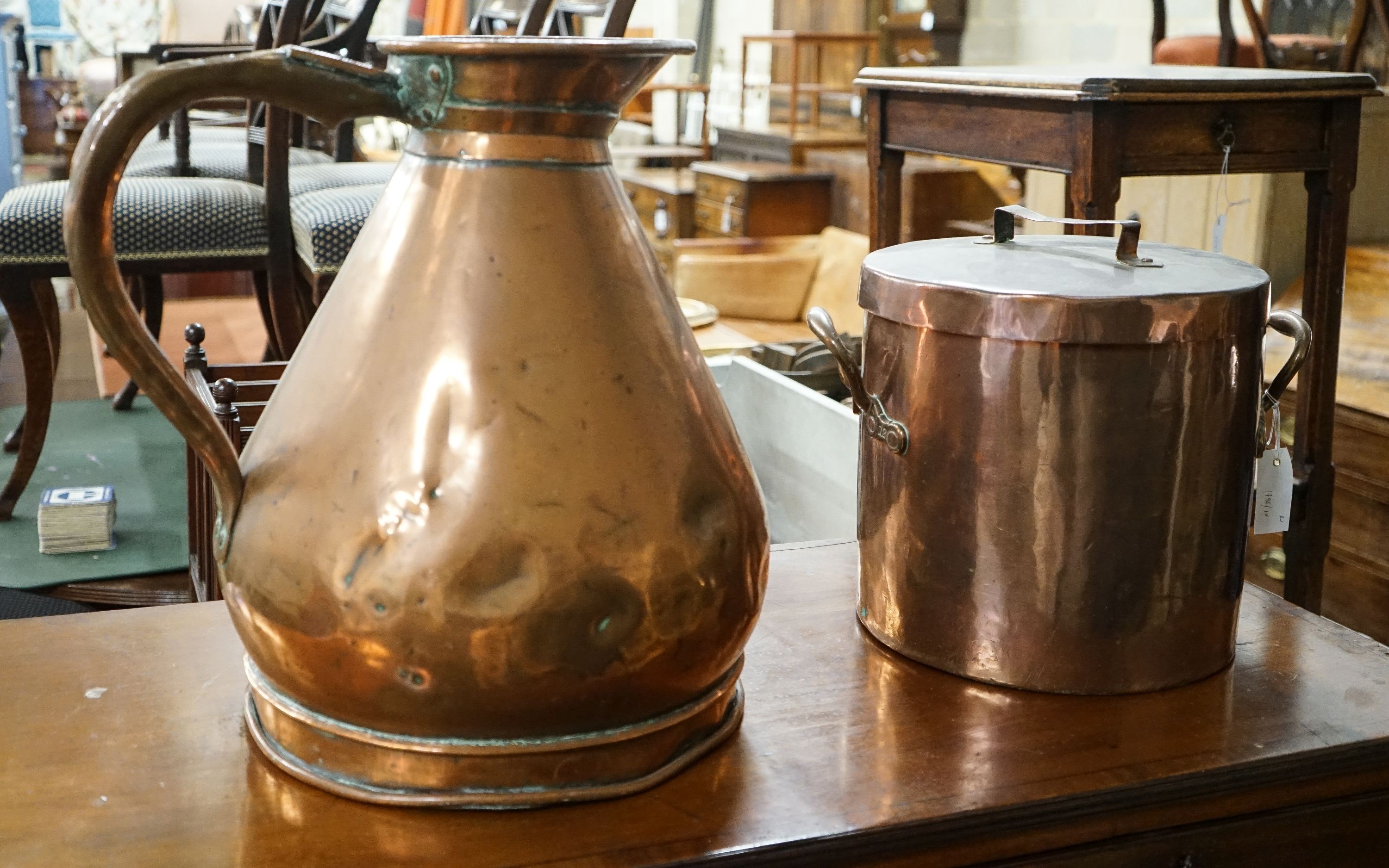 A Victorian copper jug measure, together with a Victorian copper harvest flagon, larger 48cm high